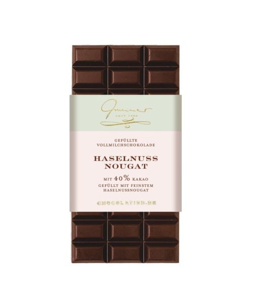Vollmilchschokolade gefüllt mit cremigem Haselnussnougat und gerösteten Haselnüssen